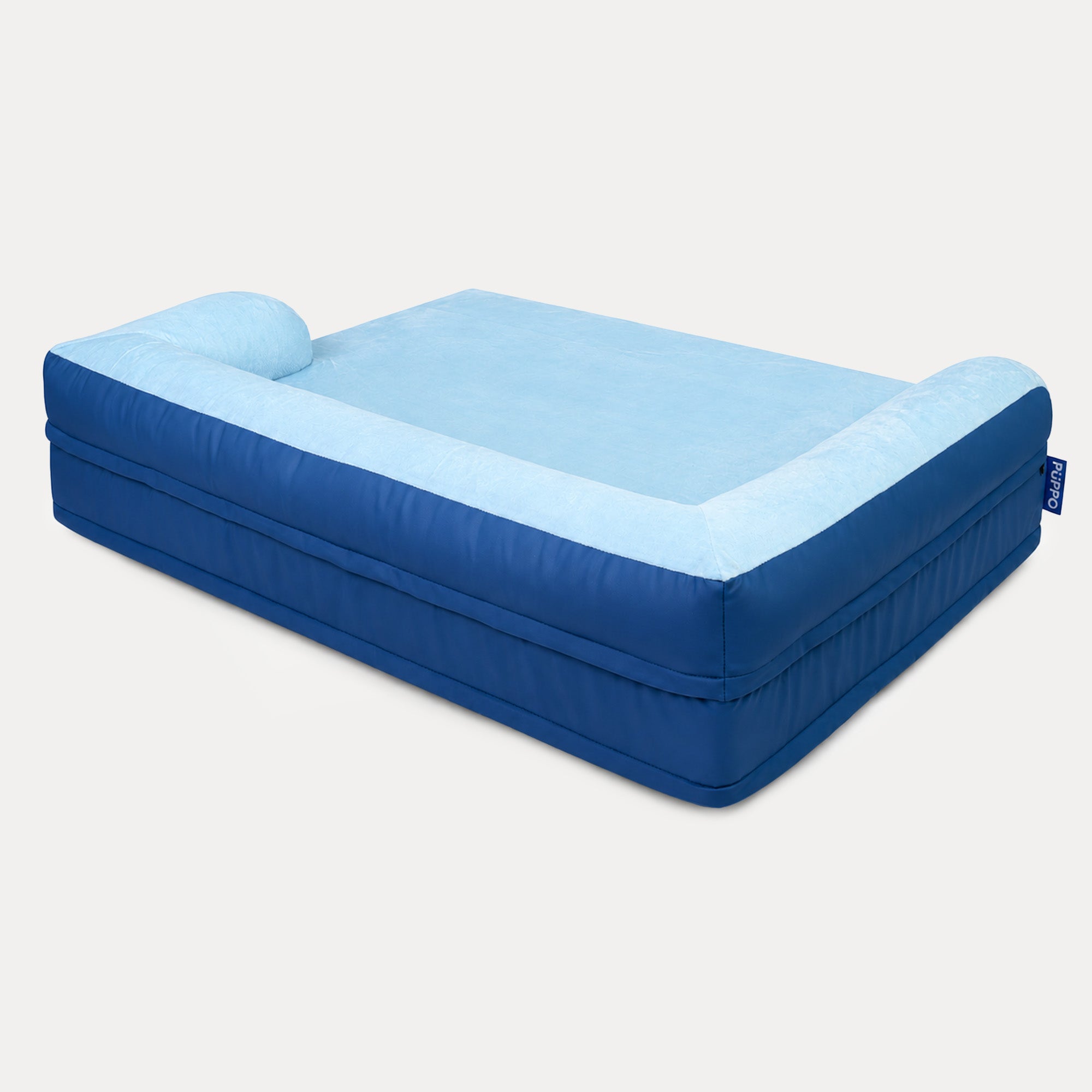 An inflatable pet bed with a two-tone blue design, featuring a darker blue outer body and a lighter blue top surface, shown on a plain light gray background.