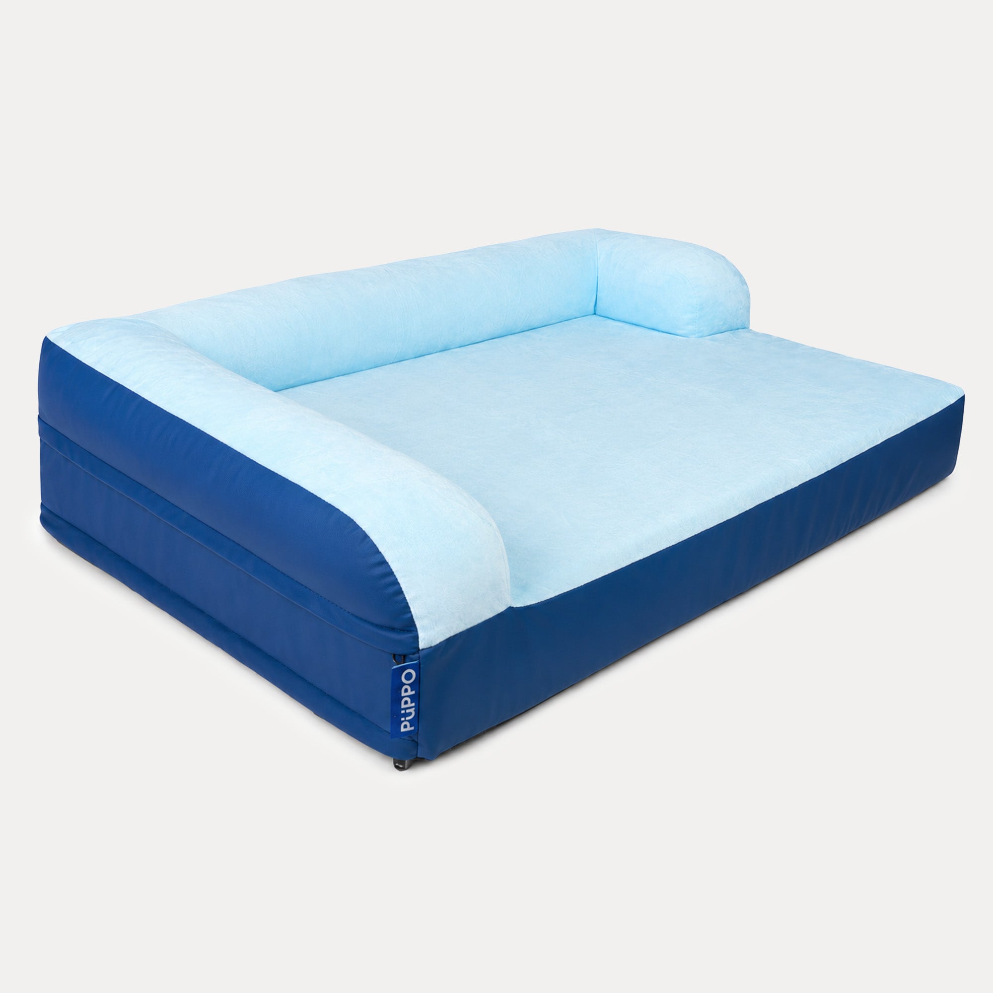 An inflatable pet bed with a light blue plush top and backrest, and a Royal blue base and sides, shown on a light gray background. The brand name 'PUPPO' is visible on a small tag on the side.